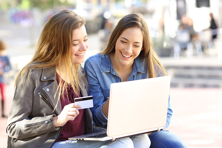 Photo of Girls Using Credit Card Online